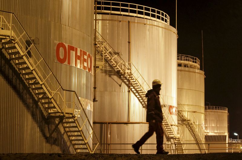 Oil prices settle lower despite OPEC+ delaying plans to boost production